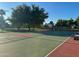 Outdoor basketball court surrounded by green trees, offering a great recreational space at 17311 N Kimberly Way, Surprise, AZ 85374