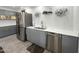 Well-lit kitchen featuring stainless steel appliances, modern cabinetry, and beautiful countertops at 17311 N Kimberly Way, Surprise, AZ 85374