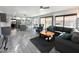 Open living room with wood-look floors, neutral colors, and a sliding door to the backyard at 17311 N Kimberly Way, Surprise, AZ 85374