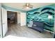 A bright living room with views to the stairway and hall, and a view of the stylish accent wall at 17311 N Kimberly Way, Surprise, AZ 85374