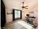 Bright home office featuring a window, a ceiling fan, and light wood-look floors at 17311 N Kimberly Way, Surprise, AZ 85374