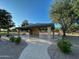 Open-air pavilion with stone columns offers a shaded gathering spot in a park-like setting at 17311 N Kimberly Way, Surprise, AZ 85374
