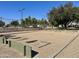 Community park recreation area featuring horseshoe pits, tennis courts, and lush landscaping for outdoor activities at 17311 N Kimberly Way, Surprise, AZ 85374