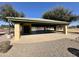 Large recreation area with a covered picnic area, tennis courts and surrounding greenery at 17311 N Kimberly Way, Surprise, AZ 85374