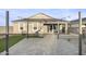 Spacious backyard featuring a patio, built-in grill, and manicured lawn at 17792 W Onyx Ave, Waddell, AZ 85355