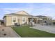A beautiful backyard with a built in barbecue and turf at 17792 W Onyx Ave, Waddell, AZ 85355