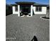 Backyard with decorative rock, patio, and xeriscape plants for low maintenance living at 18231 W Paraiso Dr, Surprise, AZ 85387