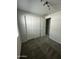 This bedroom features a carpeted floor, standard closet, and neutral paint, ready for you to make it your own at 18231 W Paraiso Dr, Surprise, AZ 85387