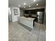 Beautiful kitchen featuring a spacious island, granite countertops, stainless steel appliances, and ample cabinet space at 18231 W Paraiso Dr, Surprise, AZ 85387