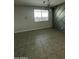 Stylish living space featuring modern lighting, decorative wall paneling, and neutral tile flooring at 18231 W Paraiso Dr, Surprise, AZ 85387