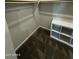 The walk-in closet includes a shelf, hanging rod, and a built-in storage cube at 18231 W Paraiso Dr, Surprise, AZ 85387