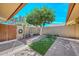 Beautiful backyard featuring a water fountain, landscaping, and artificial turf at 18835 N Palomar Dr, Sun City West, AZ 85375