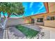 The landscaped backyard is great for relaxing, with a covered patio at 18835 N Palomar Dr, Sun City West, AZ 85375