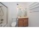 Bathroom with a shower, toilet, vanity, mirror, and overhead lighting at 18835 N Palomar Dr, Sun City West, AZ 85375