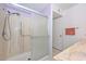 Bathroom with a walk-in shower and a sliding glass door at 18835 N Palomar Dr, Sun City West, AZ 85375