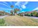Beautifully maintained lawns and landscaping surround this delightful home at 18835 N Palomar Dr, Sun City West, AZ 85375