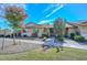 Charming single-story home featuring a well-maintained front yard with mature trees at 18835 N Palomar Dr, Sun City West, AZ 85375