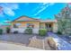 Charming single-story home featuring a well-maintained front yard with beautiful landscaping at 18835 N Palomar Dr, Sun City West, AZ 85375