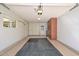 Well-lit garage with built-in storage cabinets providing ample space at 18835 N Palomar Dr, Sun City West, AZ 85375