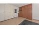 Garage with floor to ceiling cabinets and access to the exterior at 18835 N Palomar Dr, Sun City West, AZ 85375
