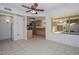 Open kitchen area featuring a large window, stainless steel appliances, and light wood cabinets at 18835 N Palomar Dr, Sun City West, AZ 85375