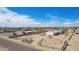 Wide aerial shot showcasing a property with a detached garage and ample space for outdoor activities at 2038 S 221St Ave, Buckeye, AZ 85326
