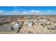 Wide aerial shot of a rural community featuring multiple homes, plots of land and clear blue skies at 2038 S 221St Ave, Buckeye, AZ 85326