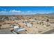 High aerial shot of a large rural residential area with various homes, desert landscaping and open land at 2038 S 221St Ave, Buckeye, AZ 85326