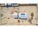 Birds-eye view of the single-story home, detached garage, and surrounding desert landscaping at 2038 S 221St Ave, Buckeye, AZ 85326