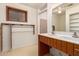 Bathroom featuring a double sink vanity, tiled floors, and a window for natural light at 2038 S 221St Ave, Buckeye, AZ 85326