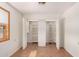 Bright bedroom features hardwood floors and an organized closet with shelving at 2038 S 221St Ave, Buckeye, AZ 85326