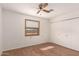 Bedroom with wood-look floors, natural light, and a closet with sliding doors at 2038 S 221St Ave, Buckeye, AZ 85326