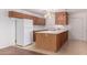 Kitchen featuring an island, white countertops, and lots of wood cabinets at 2038 S 221St Ave, Buckeye, AZ 85326