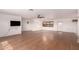 Spacious living room featuring modern wood flooring and ample natural light at 2038 S 221St Ave, Buckeye, AZ 85326