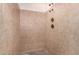 A tiled shower stall with dual shower heads and neutral color scheme at 2038 S 221St Ave, Buckeye, AZ 85326