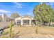 Spacious backyard with desert landscaping, hardscape patio, and lush garden at 2213 E Constance Way, Phoenix, AZ 85042