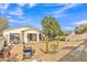 Spacious backyard with desert landscaping, hardscape patio, and lush garden at 2213 E Constance Way, Phoenix, AZ 85042