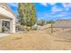 Large backyard featuring desert landscaping with a low block wall and desert vegetation at 2213 E Constance Way, Phoenix, AZ 85042