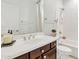 Bathroom with a large mirror above the sink and a shower/tub combo at 2213 E Constance Way, Phoenix, AZ 85042