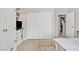 Bedroom featuring built-in shelves and ample closet space, offering ample storage solutions at 2213 E Constance Way, Phoenix, AZ 85042