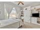 Serene bedroom with a large window, built-in shelves, and a comfortable bed at 2213 E Constance Way, Phoenix, AZ 85042