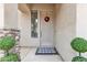 Welcoming front entrance showcasing a stylish door, decorative wreath, and manicured greenery at 2213 E Constance Way, Phoenix, AZ 85042
