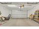 Spacious garage with a clean concrete floor and ample room for parking and storage at 2213 E Constance Way, Phoenix, AZ 85042
