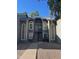 Two-story condo featuring a gray exterior, large windows, and well-maintained landscaping at 255 S Kyrene Rd # 115, Chandler, AZ 85226