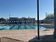 Large community swimming pool with multiple lanes and starting blocks on a bright, sunny day at 255 S Kyrene Rd # 115, Chandler, AZ 85226