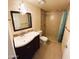 A full bathroom featuring a shower with glass doors, modern vanity, and ample lighting at 255 S Kyrene Rd # 115, Chandler, AZ 85226