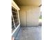 View of the exterior featuring a storage closet and covered patio area with view of grassy lawn at 255 S Kyrene Rd # 115, Chandler, AZ 85226