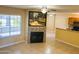Bright living room features a fireplace, a large window and seamless access to the kitchen at 255 S Kyrene Rd # 115, Chandler, AZ 85226