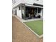 Landscaped backyard with a covered patio and green artificial turf at 2604 N 27Th St # 4, Phoenix, AZ 85008