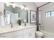 Bathroom with a double sink vanity and granite countertops with framed mirror at 2604 N 27Th St # 4, Phoenix, AZ 85008